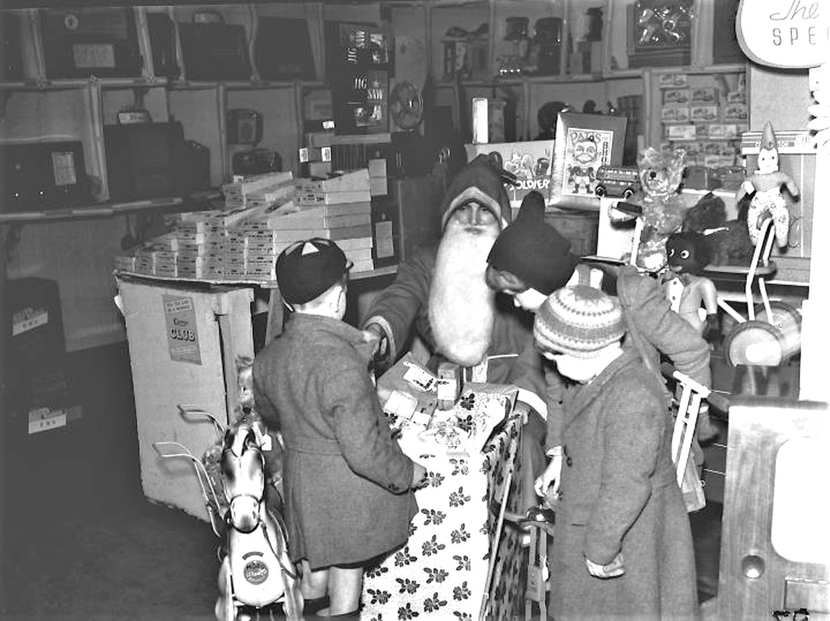 ArchandHeritage's tweet photo. It's always a treat to see Father Christmas out and about! Here he is delighting children in Staffordshire:  bestowing gifts at two Christmas parties in the 1940s, at Stafford Currys in 1950 and his 1971 Grotto at the Guildhall Co-op’s Toy Fair. Which visit is your favourite? 🎅 https://t.co/6EefeZUJxo