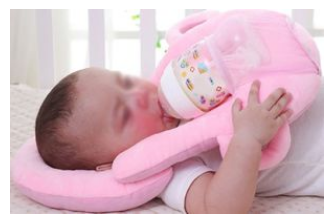 maternity_team's tweet photo. The Office for Product Safety and Standards has issued an Urgent Safety Alert for baby self-feeding pillows urging the public to stop using them and to dispose of them safely. You can read more here: https://t.co/jasftUpIvR https://t.co/APBeduxpf3
