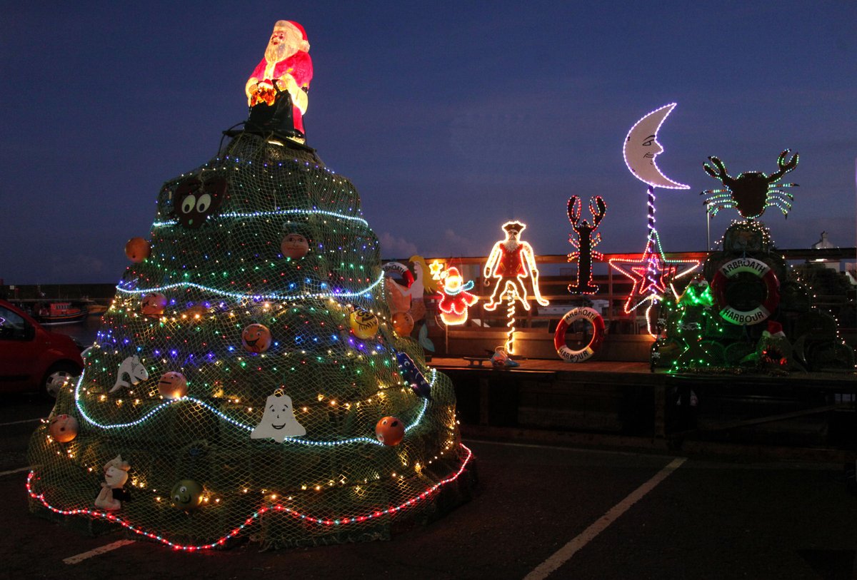 AngusCouncil's tweet photo. Christmas cheer has come to Arbroath Harbour where Grant Milne, Harbour Assistant at Arbroath Harbour has made his annual Creel Christmas Tree at the harbour, constructed to raise funds for Reach Across, a suicide awareness and mental health charity in Arbroath. https://t.co/PUTcxcB5k6