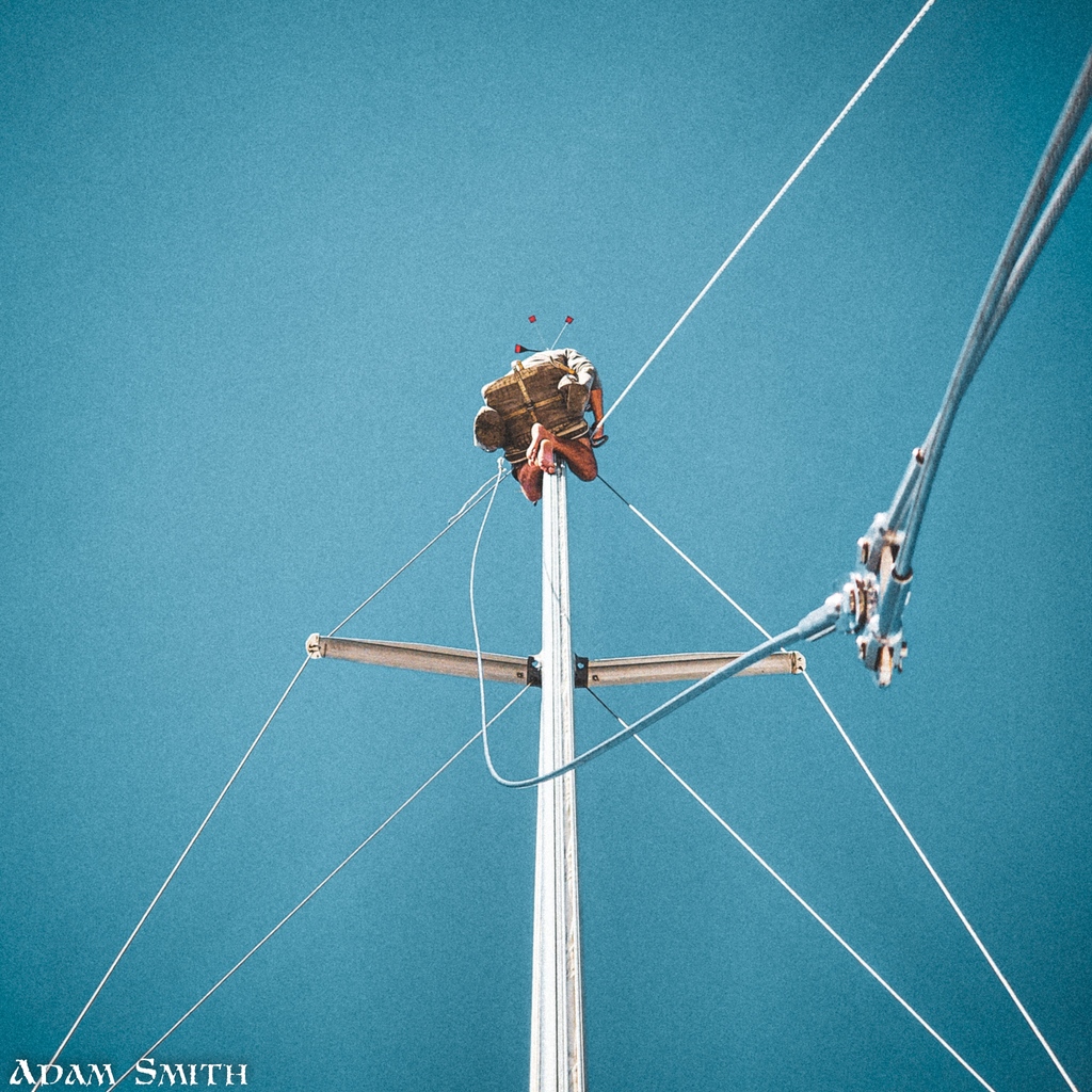 avoid_highways's tweet photo. Looking up to the top of the sailboat mast, a rigger is hard at work replacing the backstay. Follow along with us as we document the journey of our sailboat. #sailinglife #sailboat #sailboats #boating #boatlife #rigger #backstay #vintagestyle #nautical #adventureawaits https://t.co/QD64UqLPUI