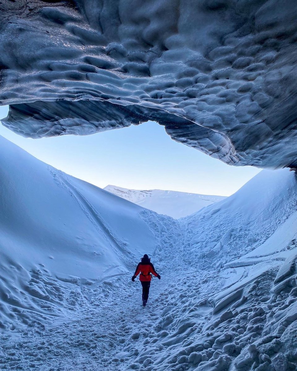 There are SO MANY fun winter activities beyond skiing. 
❄️ Go dog sledding at @icehotelsweden. 
❄️ Stay in a cozy igloo beneath the Northern Lights at @kakslauttanen_arctic_resort in Finland.
❄️ Explore ice caves in the tippy top of Norway, like this one from <a href="/visitsvalbard/">Visit Svalbard</a>.