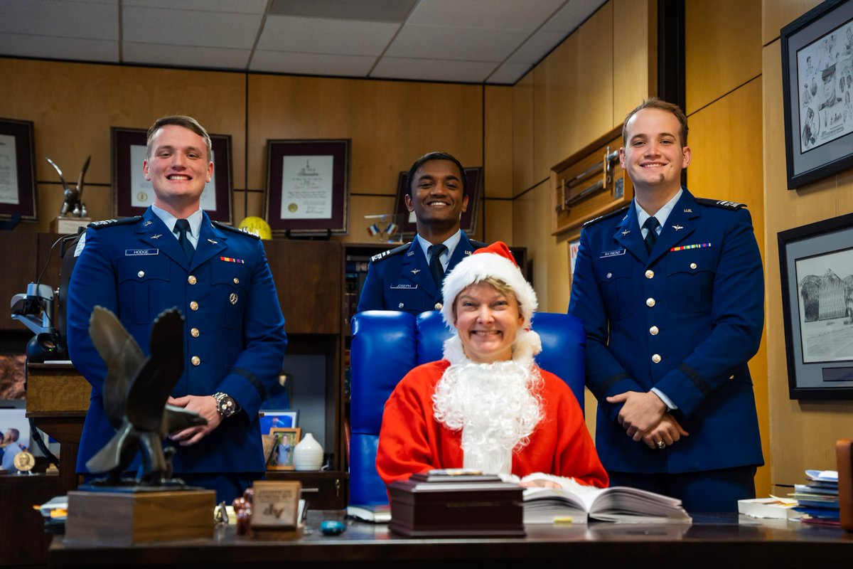 🎅 Cadets got into the holiday spirit with the Dean - hoping perhaps to get on her nice list!  
C1Cs Donovan Hodge, Daniel Joseph and Cayden Raymond have a tradition of taking Santa pictures in service dress. This year they convinced the Dean to be Santa for them. 
#holidayfun