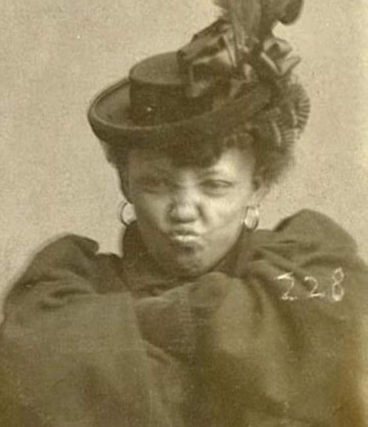 Goldie Williams, a rebellious woman who was arrested for vagrancy. She refused to unfold her arms and stop making this face for her 1898 mugshot.
