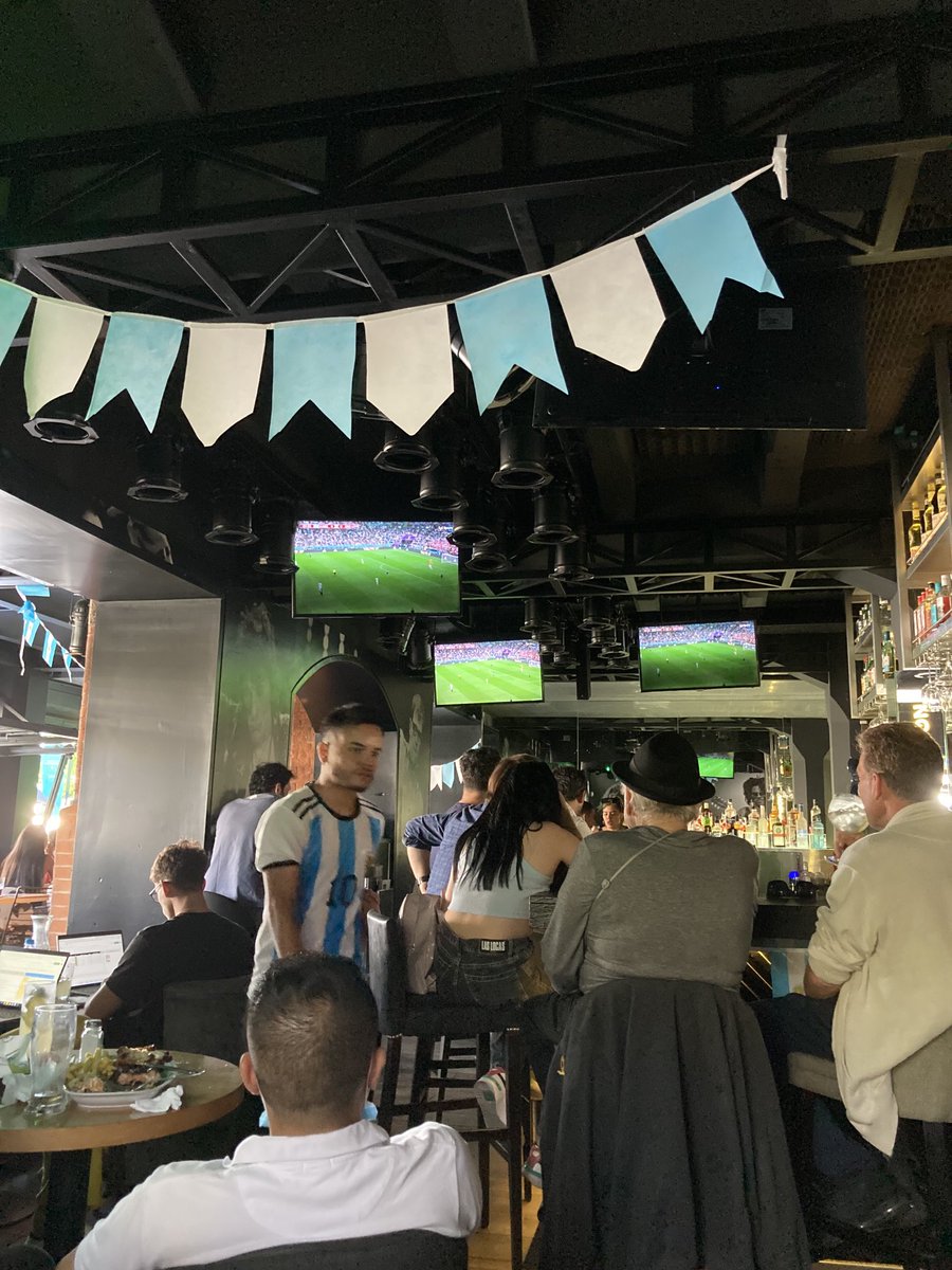 JohnSimpsonNews's tweet image. Watching the Argentina-Croatia match in a crowded bar in Buenos Aires.  The noise is deafening, the excitement pulsating. ‘We need to win so badly, with our economy and our politics,’ says one woman.