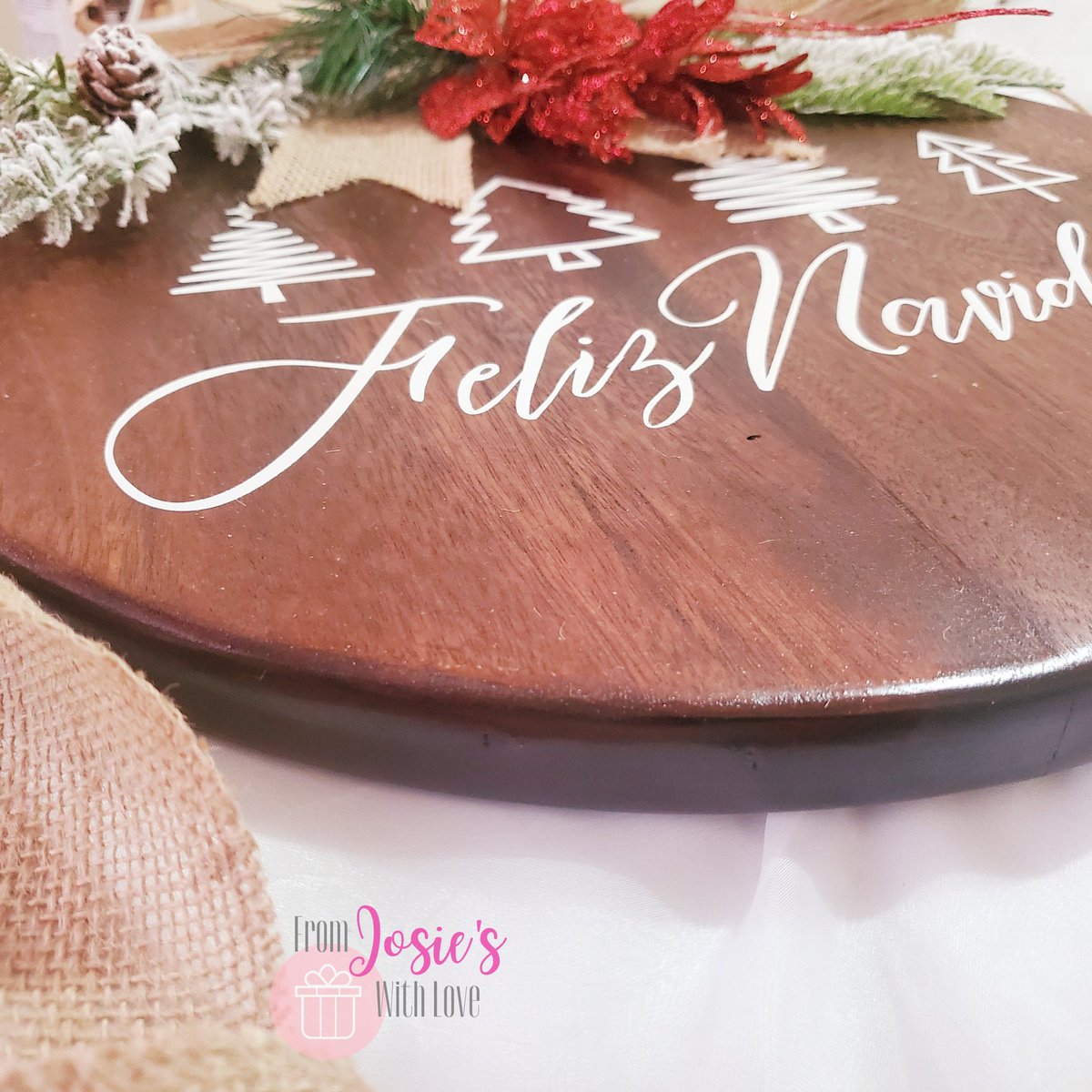 Here's our final Christmas Themed hanger for 2022!

- Made with high quality local hardwood (appamat)
- Reinforced, treated, stained and sealed for durability and longevity
- Approx. 15" diameter x 1" thick
- D-rings installed, fitted with jute twine, and ready to hang!

$350