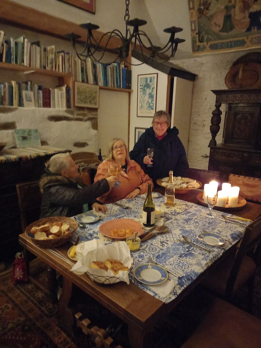 Ecomony dinner by candlelight with coats on...