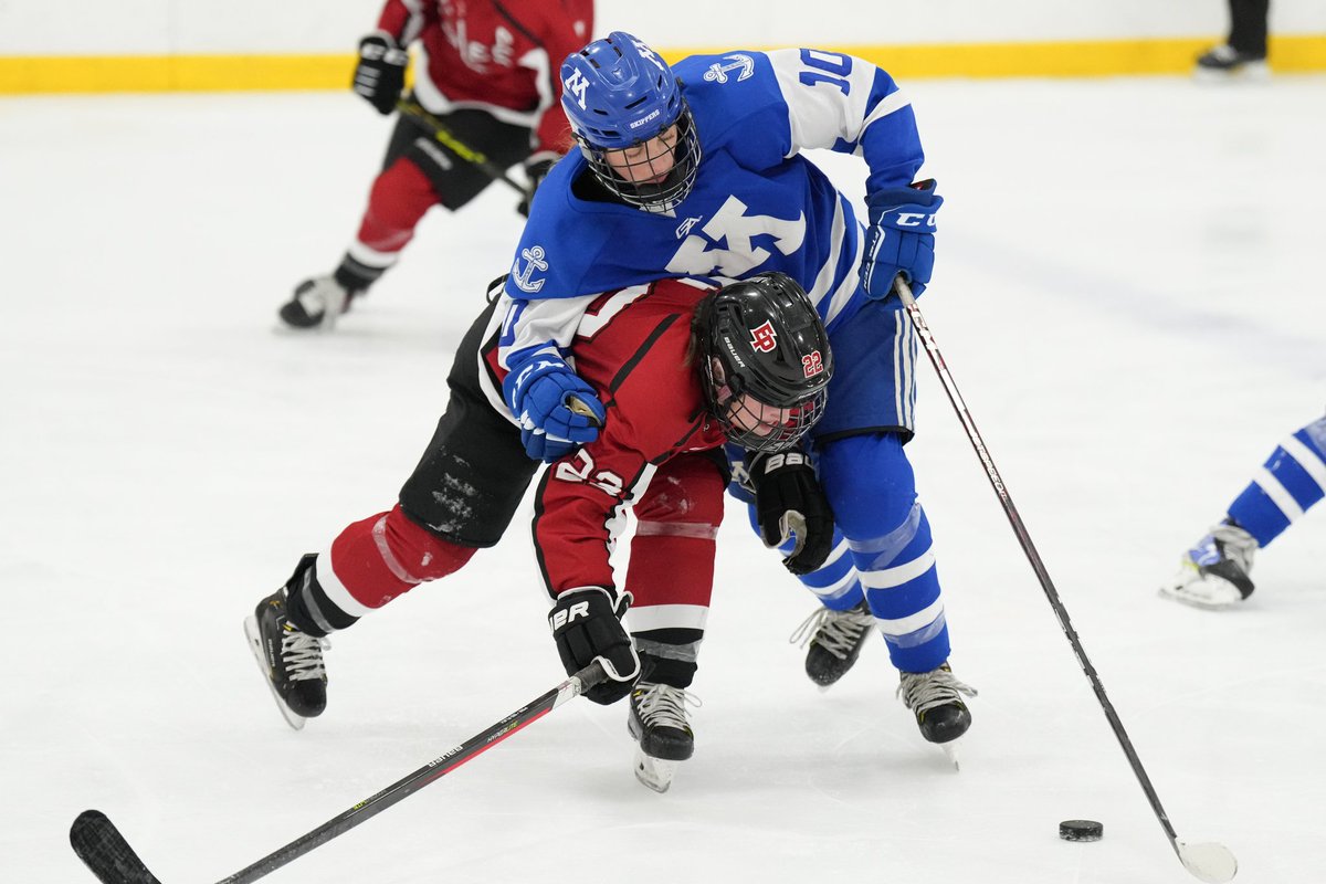rickolson77's tweet photo. Minnetonka leads Eden Prairie 8-0 after two period of play. Eagles #22 Paige Holt and Tonka #10 Grace Larson battle for the puck in the middle frame. https://t.co/Fsmnza3g78
