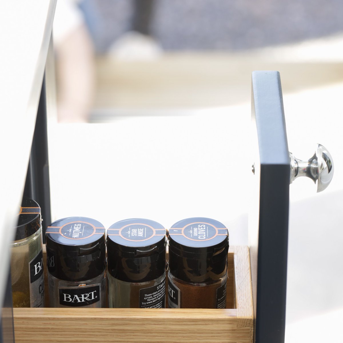 This skinny pull-out drawer is perfect for storing spices; the oak interiors to the navy-blue shaker with silver finish handles make it gorgeous too.
