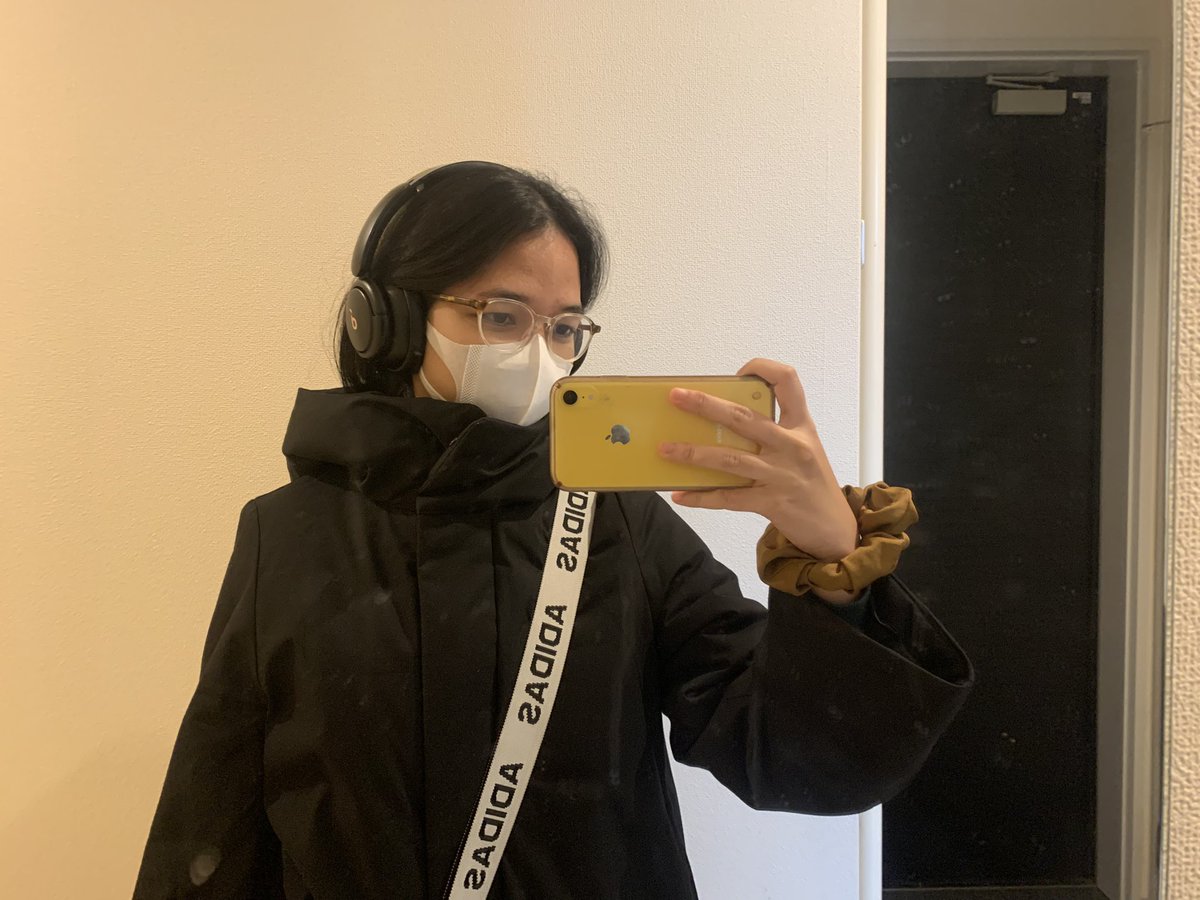 nadila has graduated from her usual thrifted green checkered oversized winter jacket to a boring adult appropriate black down coat its a new era