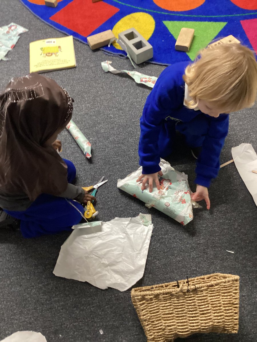 Nurserystm1's tweet photo. Practising our cutting skills and fine motor skills by wrapping up toys. #STMead #STMphysicaldevelopment #STMeyfs https://t.co/8s4P1vw18S
