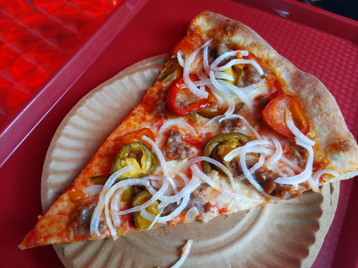 Love the Italian sausage, cherry peppers, onions, and honey slice at Made In New York Pizza