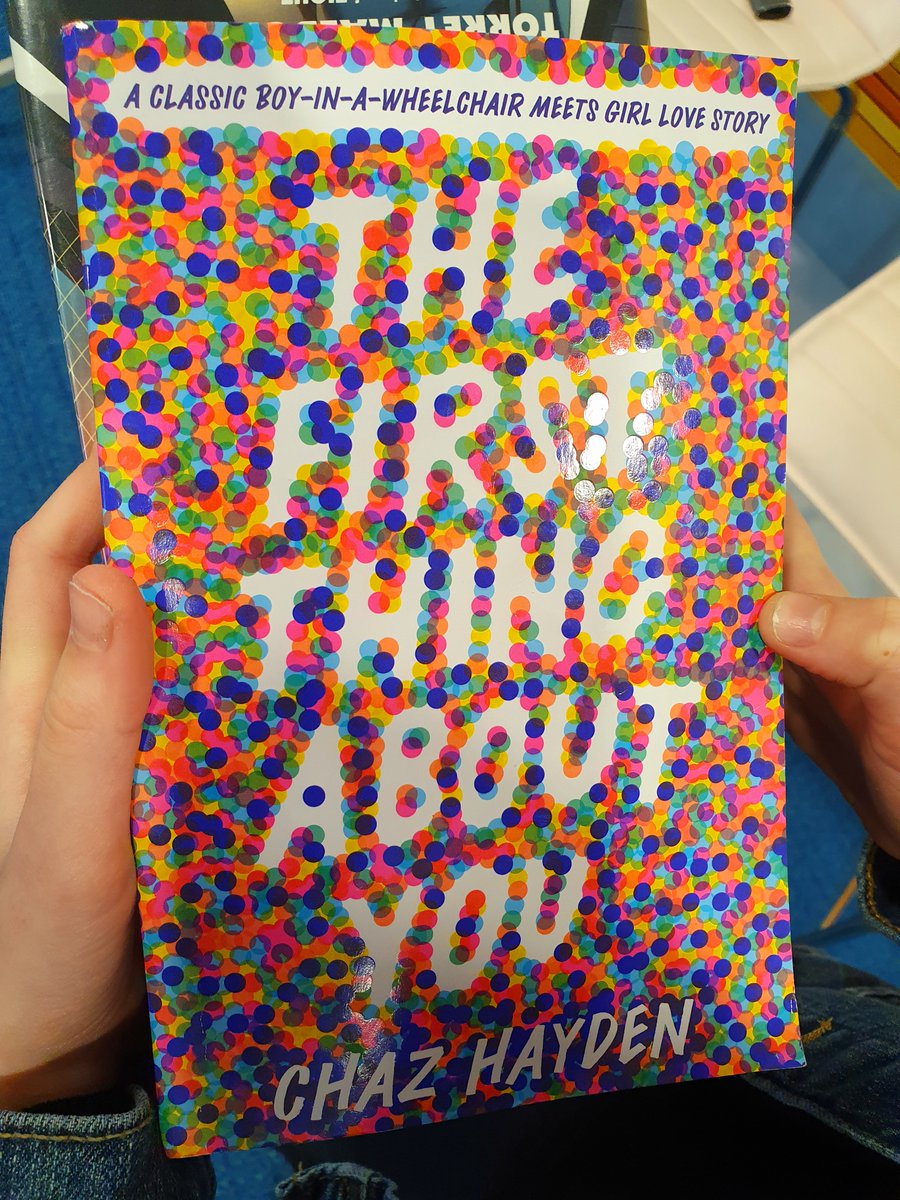 @100scopenotes @MrSchuReads Just read abt YA COVER OF THE YEAR: THE FIRST THING ABOUT YOU BY CHAZ HAYDEN (DESIGNED MY MATT ROESER). Lo & behold, look what immediately showed up in the hands of a lovely @IntlSchAmst G7 student today. Is this #SchoolLibraryLife #Kismet?

#ISAreads #YALit #inTLchat #TLchat