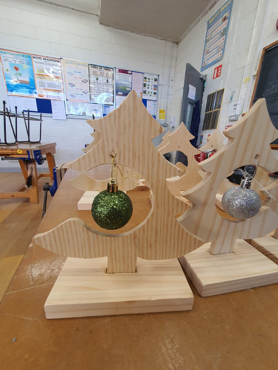 cbssecmtown's tweet photo. Mr Bricks lunchtime woodwork club’s finished handmade Christmas tree decorations were on display today. Fantastic work undertaken by both the students and Mr Brick 👏👏 #lunchtimeactivities #extracurricularactivities https://t.co/qZfLeNf3uo