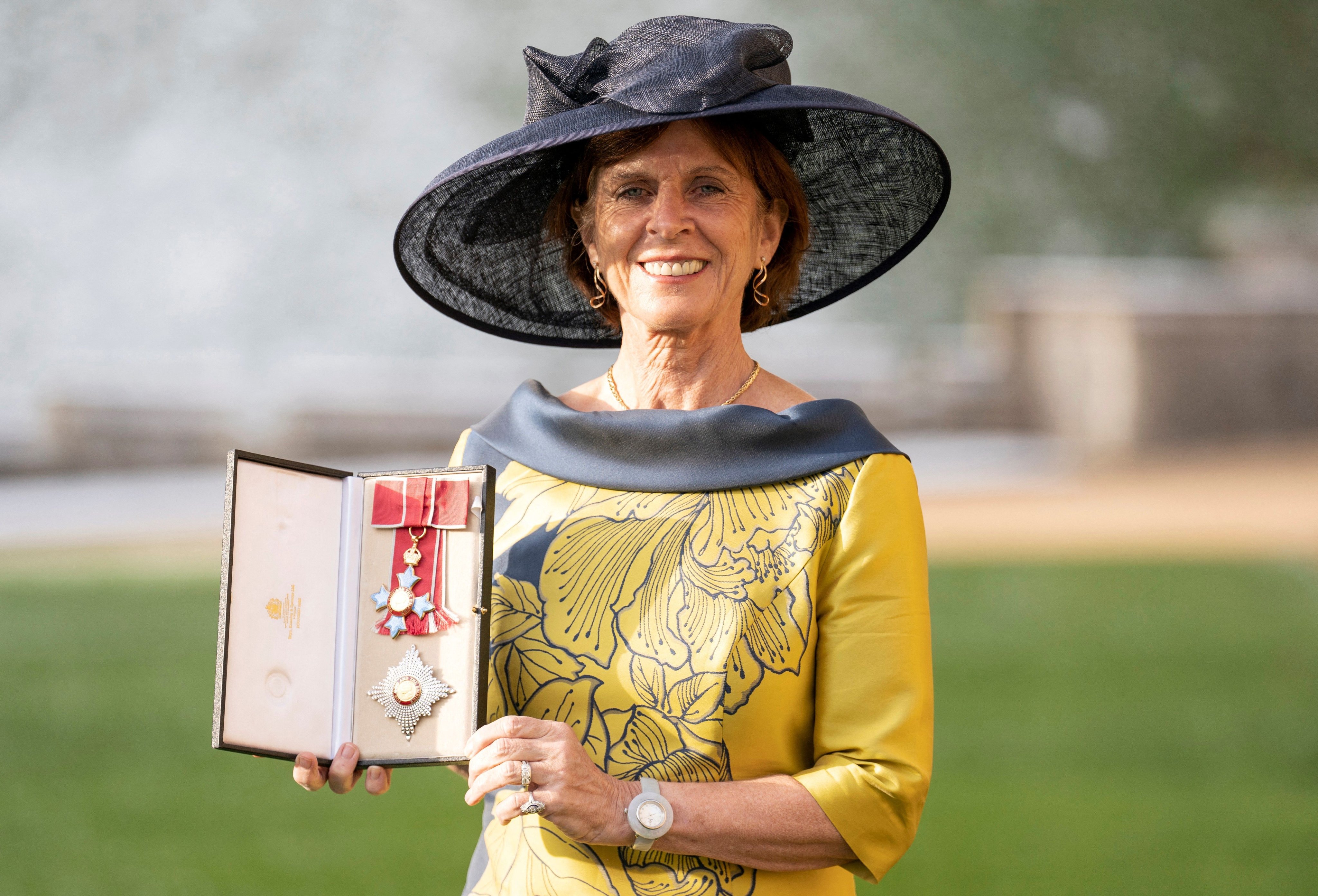 Dame Louise Richardson holds her insignia 