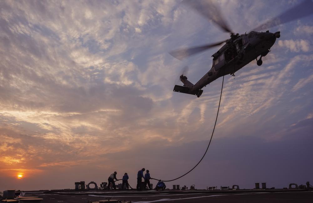 USS The Sullivans #DDG68 conducts helicopter in-flight refueling operations with an MH-60R #SeaHawk helicopter assigned to Helicopter Sea Combat Squadron #HSC26, Detachment 1, in the Arabian Gulf. The ship is deployed to the U.S. 5th Fleet area of operations.