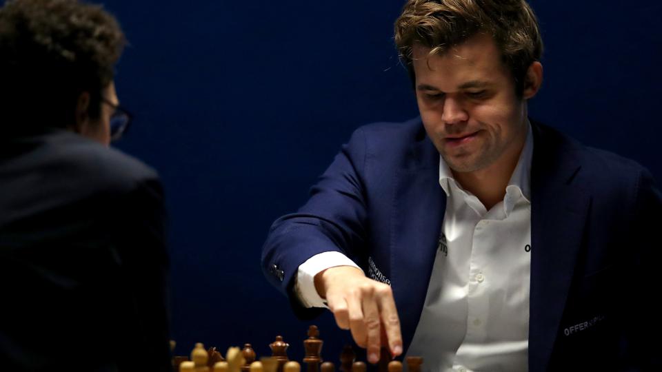 Forbes's tweet photo. Chess’ $100 Million Showdown: Carlsen Moves To Dismiss Niemann Lawsuit Over Cheating Allegations https://t.co/dznEiuHtNe https://t.co/Akm3FQo3mQ