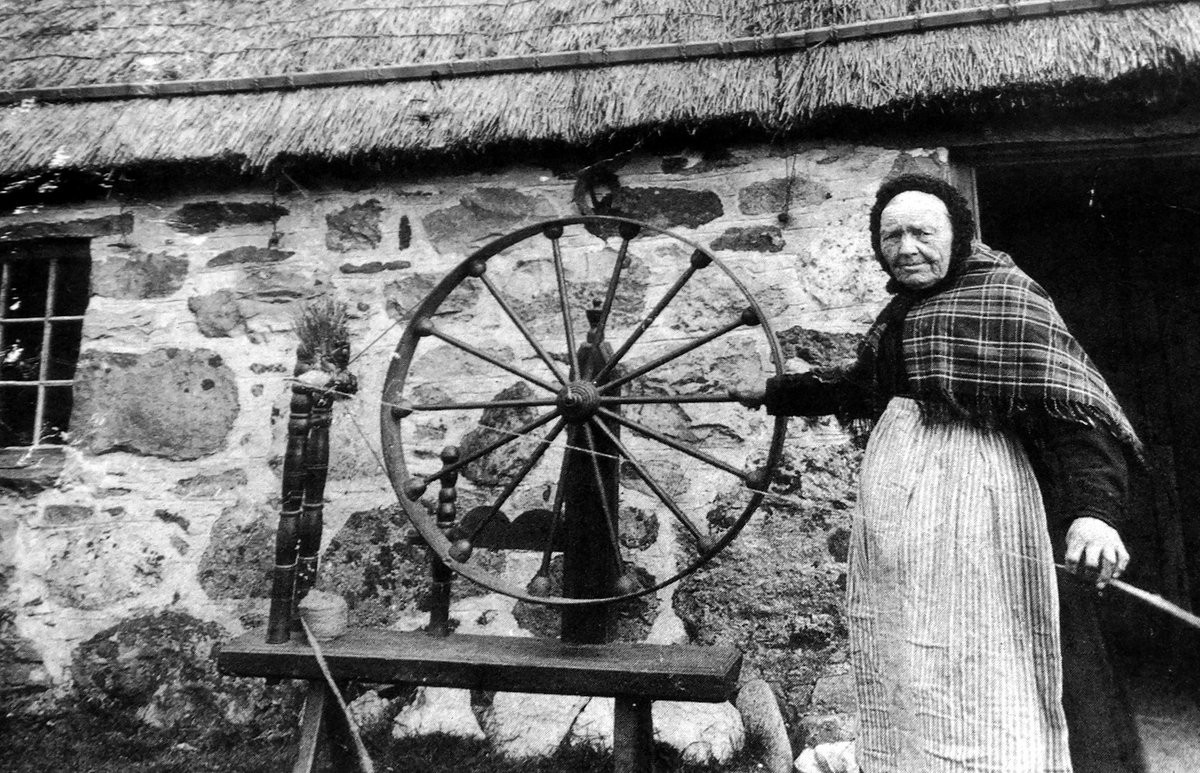 tourscotland's tweet photo. Old Tour #Scotland Ancestry travel visit Genealogy Scottish Family History Blog photography of an elderly crofter with her spinning wheel outside her thatched cottage dwelling in #Tarfside in #Glenesk, #Angus around 8 miles north of #Edzell https://t.co/3iKz2ZzAwa https://t.co/suaeLdKgBB