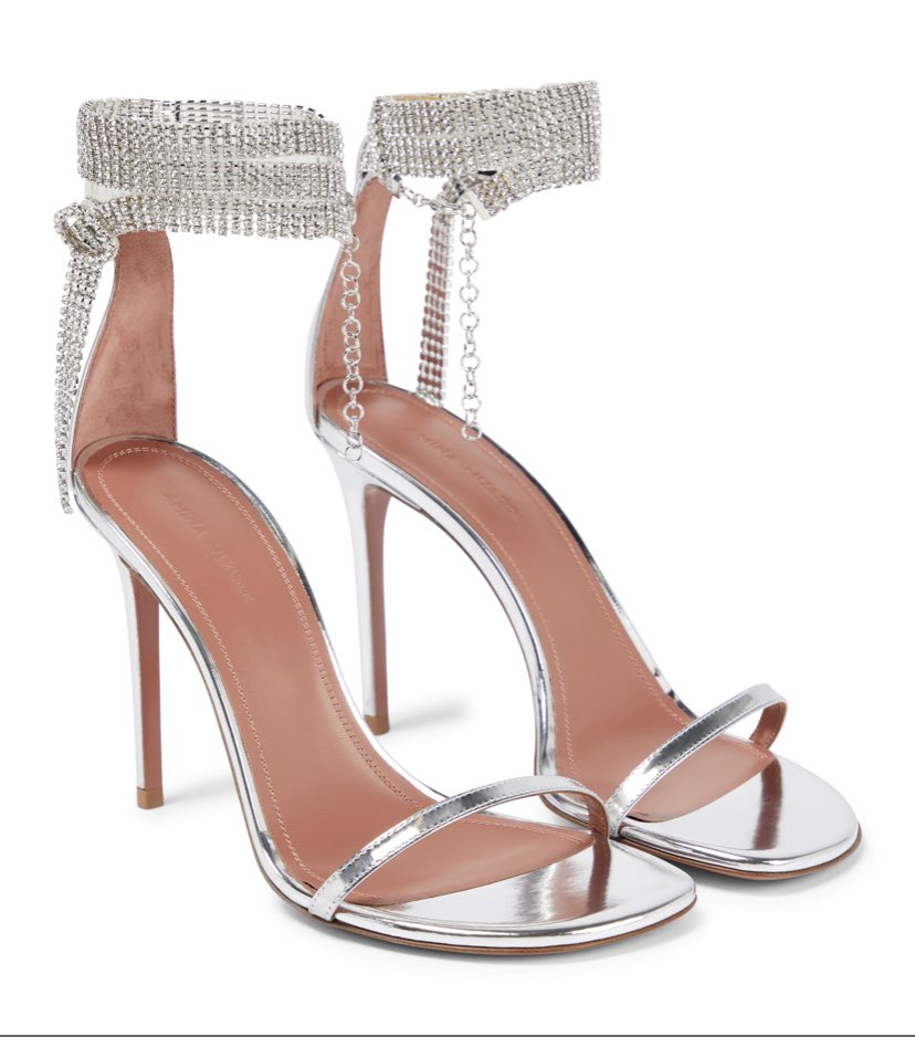 Rihanna wears Amina Muaddi Giorgia Crystal Sandals in Mirror Leather in Miami.