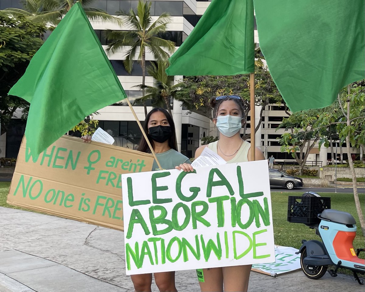 Refusefascismhi's tweet photo. Spreading green 4 abortion rights in front of the Honolulu Federal Courthouse on the anniversary of the SCOTUS arguments that overturned Roe v. Wade!  #green4abortion, #riseup4abortion, #legalabortionnationwide https://t.co/0IHkbDYYMy