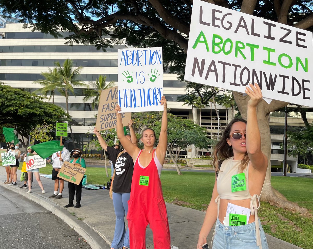 Refusefascismhi's tweet photo. Spreading green 4 abortion rights in front of the Honolulu Federal Courthouse on the anniversary of the SCOTUS arguments that overturned Roe v. Wade!  #green4abortion, #riseup4abortion, #legalabortionnationwide https://t.co/0IHkbDYYMy