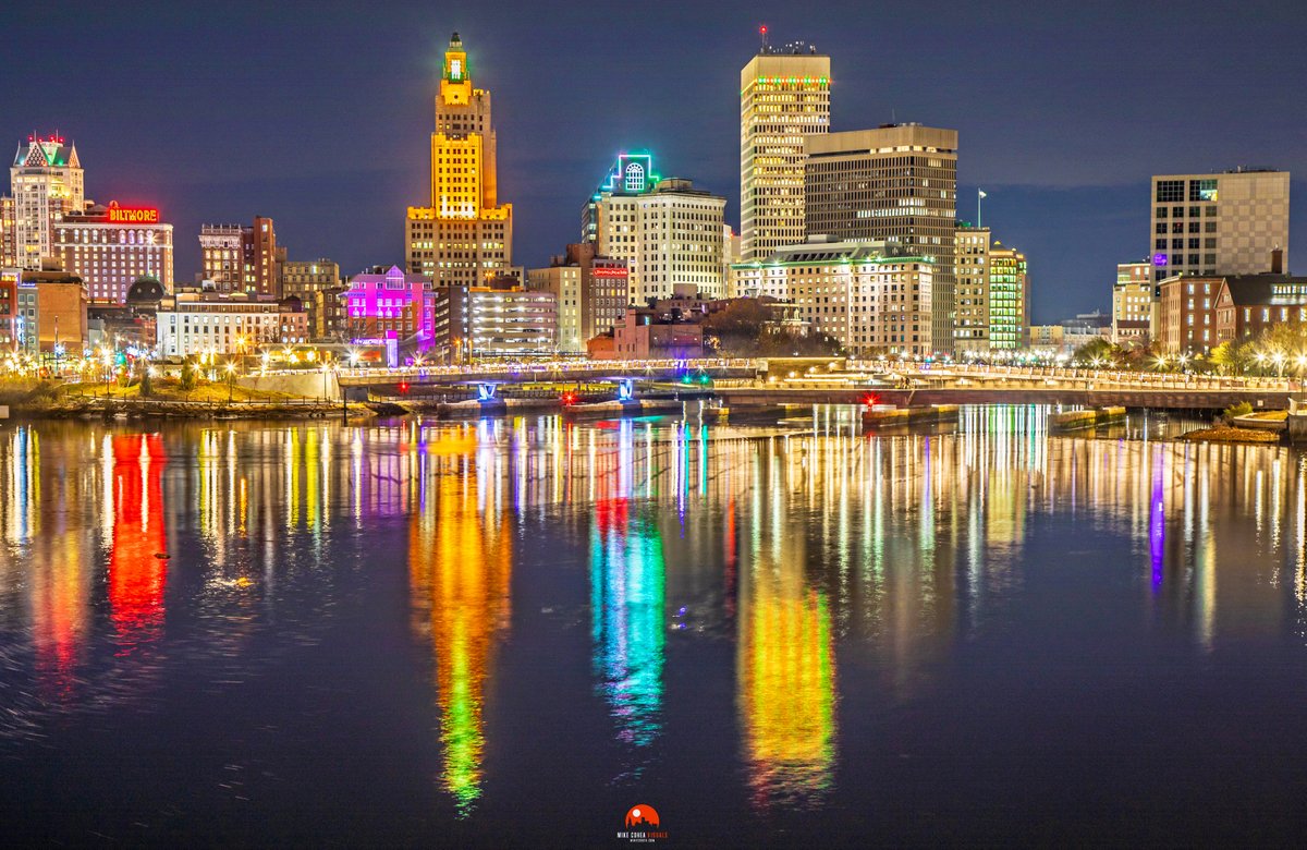 An iconic view of the festive Providence, Rhode Island skyline this evening from the Point Street Bridge. After 10 years, the Superman Building is once again lit.