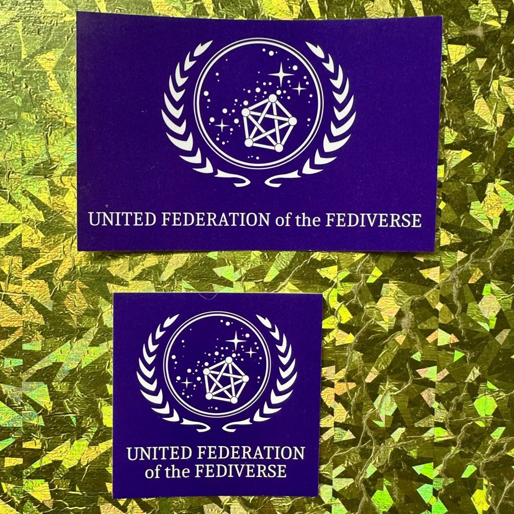 derPUPE's tweet photo. 🚚 Die #Sticker Lieferung is da 📦
 
 „United Fedration of #Fediverse“ 

Sie werden via #C3STOC verteilt.

mitmachen / beitragen: https://t.co/N6sHq16CCP

cc-Info &amp; Download zum durch @Mu11ana verfeinerten &amp; vectorisierten Meister:innen-Werk gibts hier:

https://t.co/0seclWsIUv https://t.co/rmX3GkJtzF