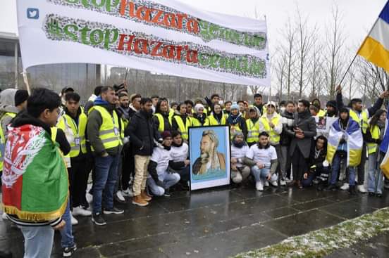 Bayani_Aman's tweet photo. Street march and protest in a rainy weather in Berlin to raise voices against Hazara Genocide in AFG. #StopHazaraGenocide 
Protesters were calling @UN wake up. #RecognizeHazaraGenocide Please share and post about this protest to create awareness globally. https://t.co/Y6DlZY0rWA