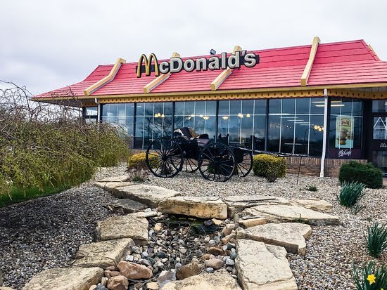 GoodKarmaSam's tweet photo. @LumpyTouch I grew up in sugarcreek Ohio, which is a small town that has a BUNCH of Amish people living there. The local McDonald's has a buggy on the outside. It also has some artwork made by a local artist that has a wooden train going through the landscape with McDonald's characters in it https://t.co/GFZOkuWf8o