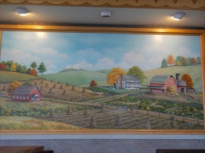 GoodKarmaSam's tweet photo. @LumpyTouch I grew up in sugarcreek Ohio, which is a small town that has a BUNCH of Amish people living there. The local McDonald's has a buggy on the outside. It also has some artwork made by a local artist that has a wooden train going through the landscape with McDonald's characters in it https://t.co/GFZOkuWf8o
