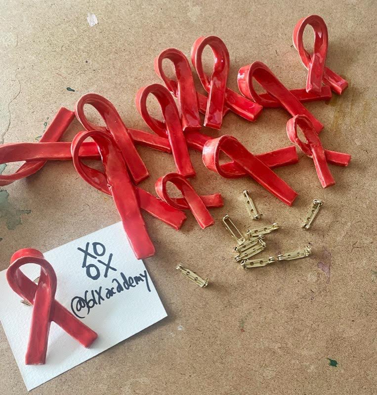 Big shoutout to @6IXAcademy for doing their part for @canfar1987  #worldaidsday♥️
Thank-you Tomi + Lyla for all your hard work sculpting “Pendants of Positivity” to end the stigma for those living with HIV. 
@thejamesinthecity looking fab in our design🤩