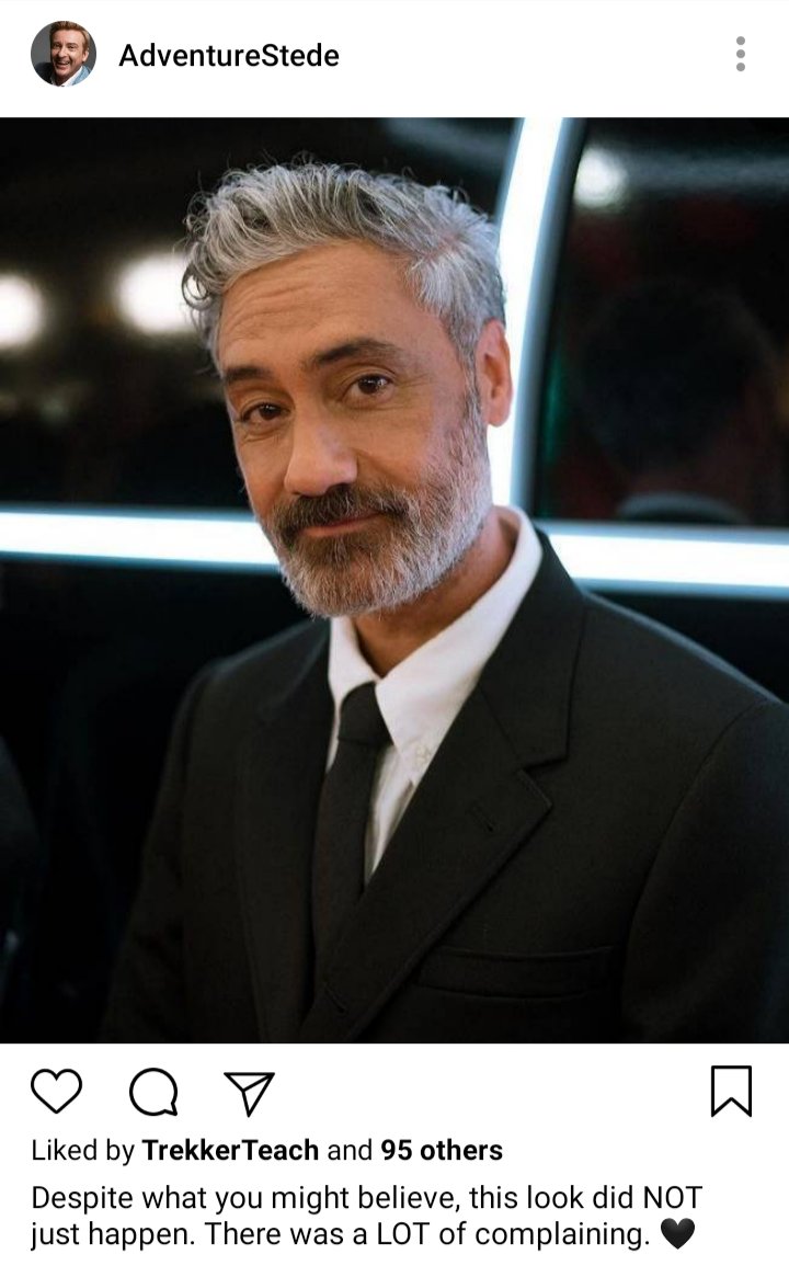 Stede's IG. Photo of Ed in a black suit and tie smiling for the camera. Caption reads "despite what you might believe, this look did NOT just happen. There was  a LOT of complaining." 🖤