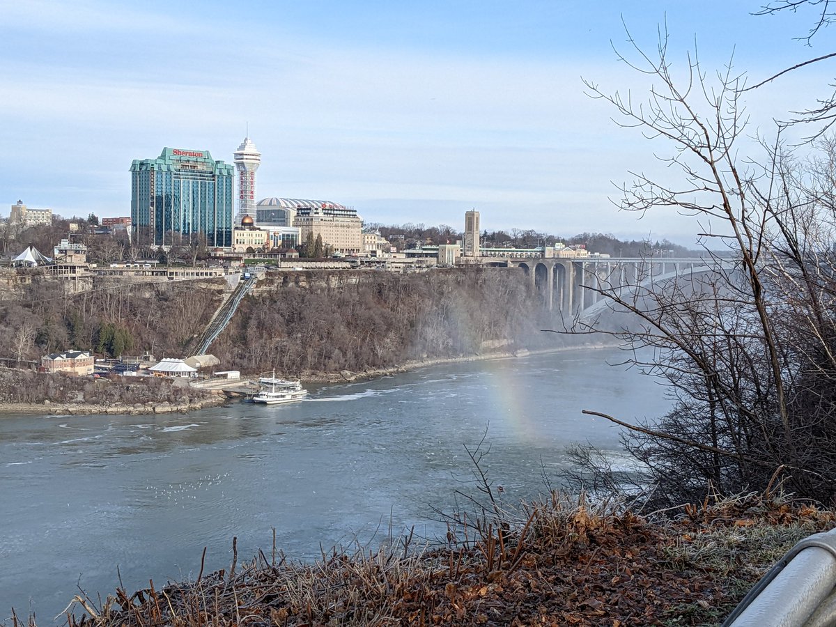 DruTarr's tweet photo. Quick detour on the road trip today to Niagara Falls! You can clearly see how Rainbow Bridge got it's name. Benefits of a winter visit: fewer tourists. Drawbacks: freezing mist. https://t.co/6C2x2S9InH