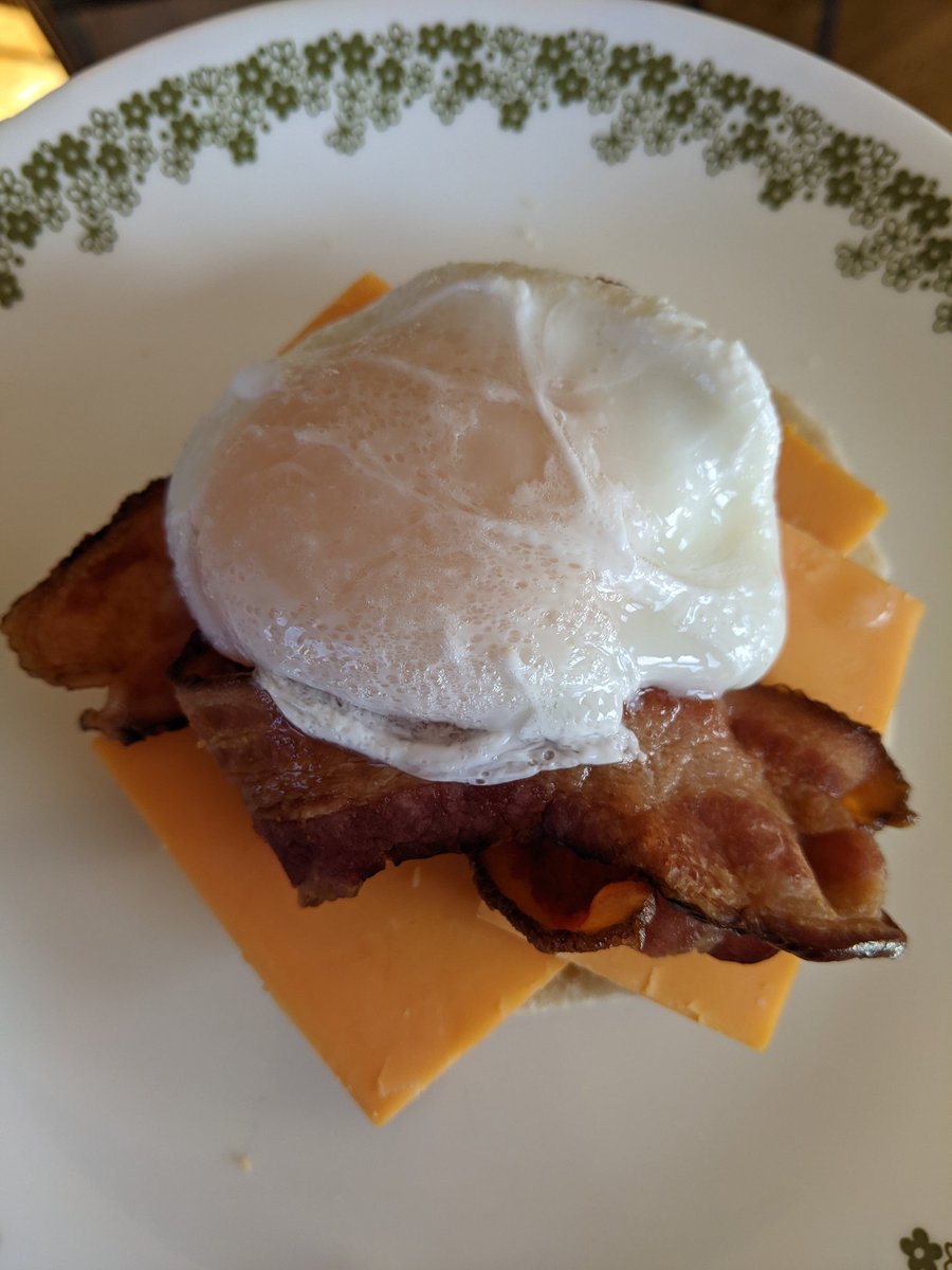WisSkier's tweet photo. Poached egg, on an English muffin, sharp cheddar, and @Nueskes bacon. #TwitterSupperClub. #YouBetchya there is ☕ at hand! https://t.co/oot8NEjIBQ