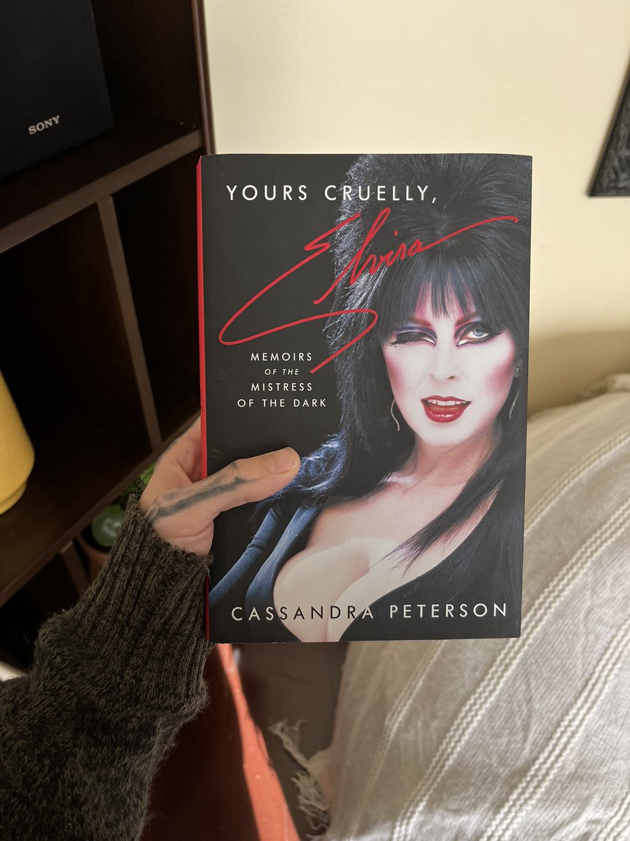 RAVESODA94's tweet photo. Since Elvira is trending, know about her memoir. It’s absolutely hilarious and well worth the read! There are even old Polaroids she included in the middle. So glad to have this! #Elvira #elviramistressofthenight #mistressofthenight https://t.co/2eXYsvVzc3