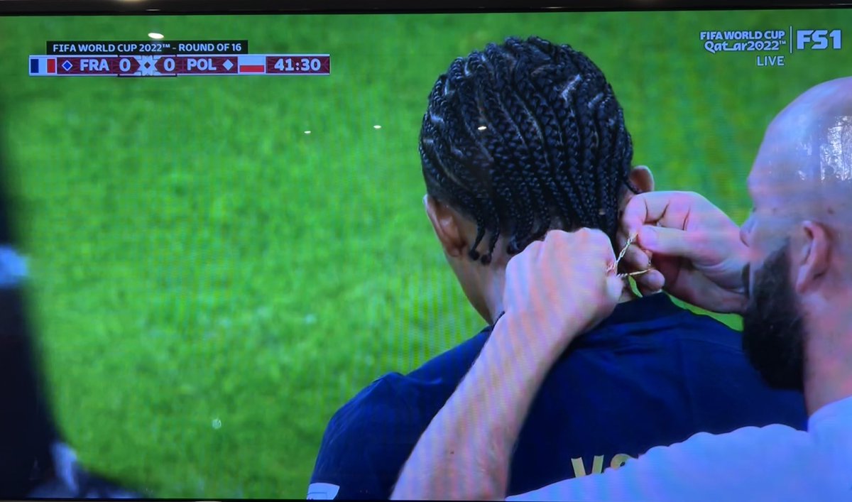 dajmeyer's tweet photo. In the 42nd minute of today’s #FRAvsPOL #WorldCup2022 game, a referee notices @jkeey4’s necklaces and makes him remove them. Shades of when I was coaching Ms14’s U8 &amp; U10 soccer teams &amp; had to make sure their necklaces were off &amp; their earrings at least taped over before games! https://t.co/O2HimJ0X31