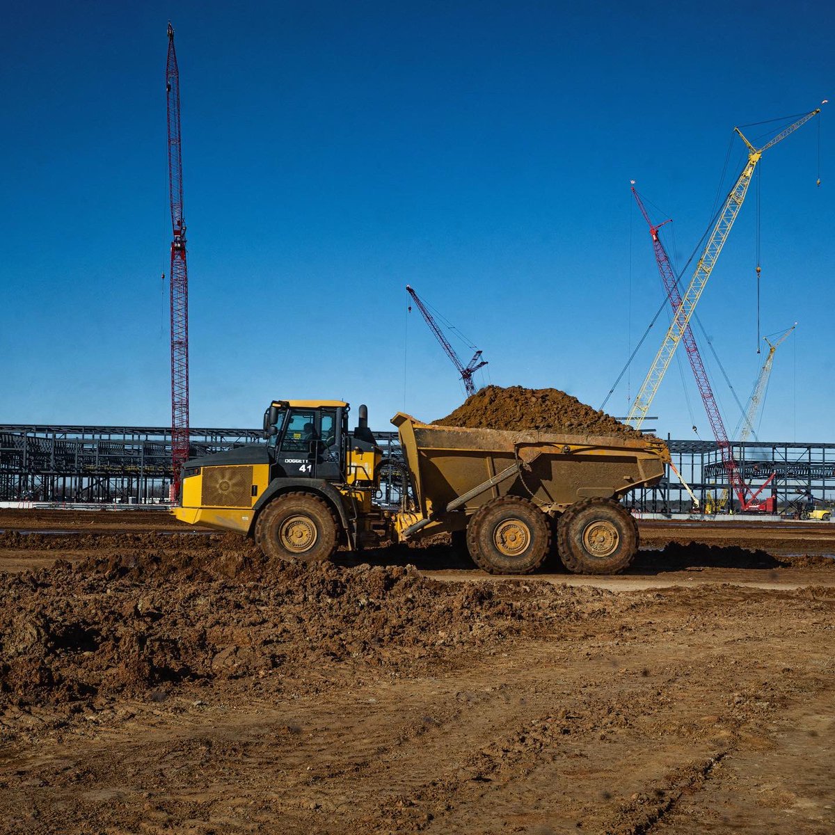 Ford's tweet photo. Ford and SK On broke ground at BlueOval SK Battery Park, where our joint venture – BlueOval SK – has invested $5.8B to produce advanced batteries for future @Ford &amp; @LincolnMotorCo #EVs, slated to start production 2025, creating 5,000 new jobs in KY. #BuiltForAmerica #BlueOval_KY https://t.co/vWfd13rC7H