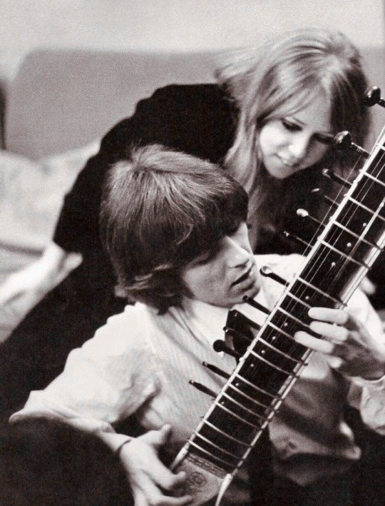 Patti Boyd watches over George Harrison’s first steps on the sitar, late 1965.