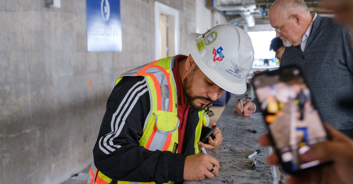 sixthandguad's tweet photo. We are still in awe of reaching our Topping Out milestone last month. 

The @JEDunn team celebrated the big achievement with a lunch for the workers and the project teams – followed by a longstanding tradition of raising a signed beam at the top of the building! #toppingout https://t.co/4XbG6xpVEW