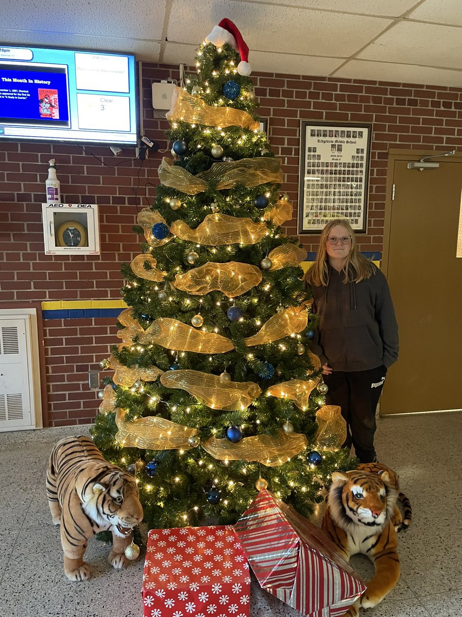 RidgeviewMiddle's tweet photo. It has been a tradition for the past three years that Alexis helps decorate our Christmas tree. Thanks Alexis for adding your special sparkle. @ASD_West https://t.co/nb3HFor68y