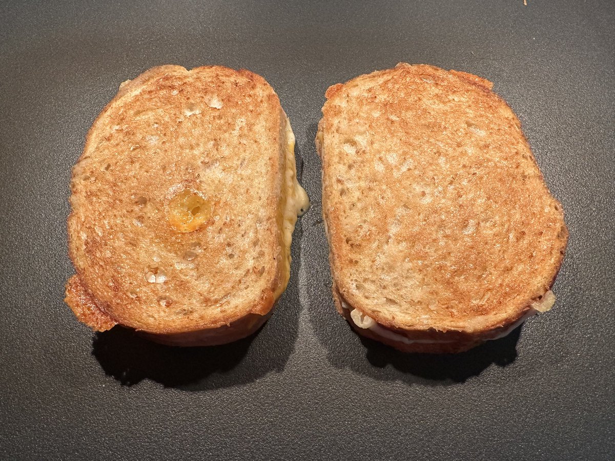 kenunderthebus's tweet photo. What’s for lunch today? 

Sharp cheddar, white cheddar, and Gouda on sour dough. https://t.co/I9y3gbdilp