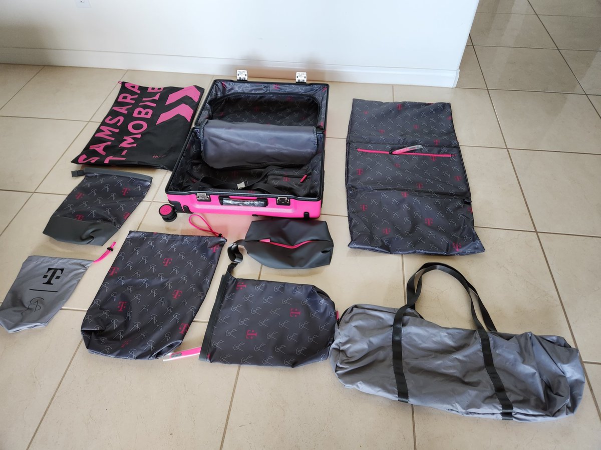 MyTechMusings's tweet photo. Preparing for a short trip. This @TMobile @SamsaraLuggage suitcase is a perfect fit for 2-3 day visit - Tons pouches to keep clothes seperated, integrated battery bank &amp; complete with #AppleTag 

The $tmus magenta color is unmissable.. https://t.co/v0le2pqo42