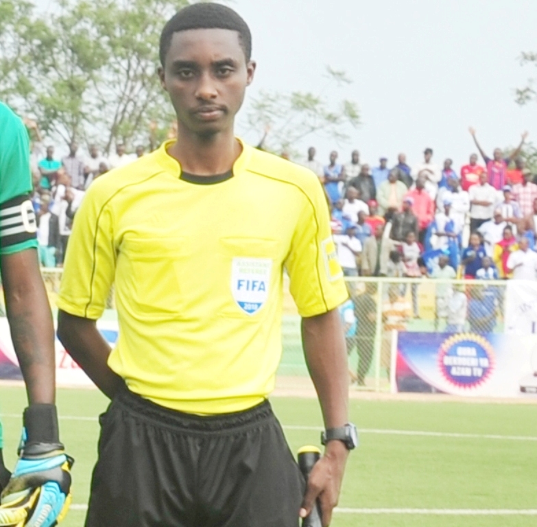 Rwanda International Football Center referee, Samuel Uwikunda and Linesman  Dieudonne 