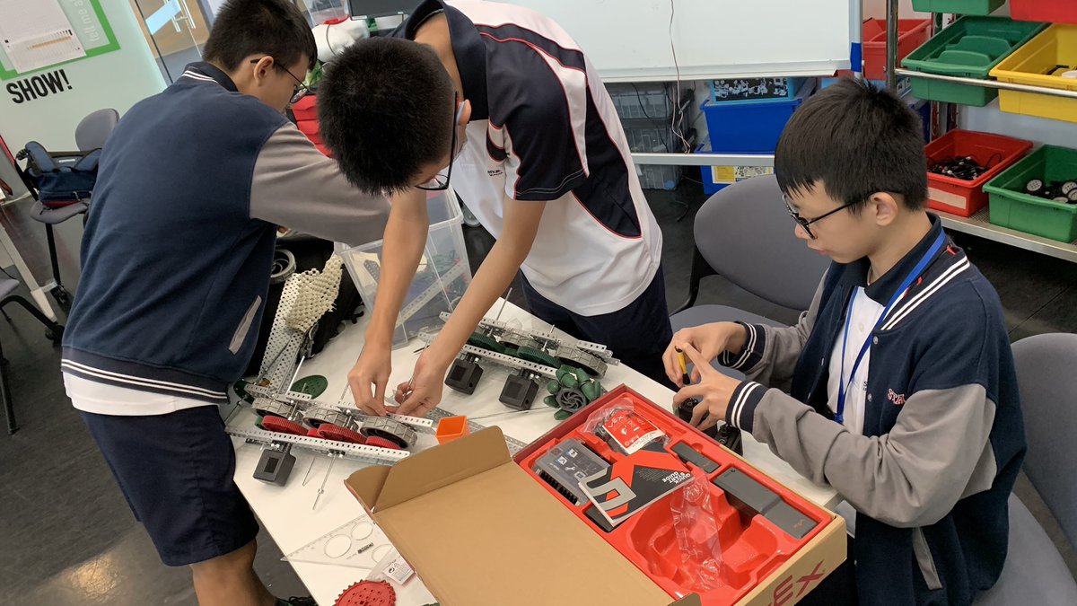 NoahkahanTours's tweet photo. #SAISRobotics all female team putting together their chassis, gr 9 team assembling their drive & figuring out the coding and the senior team totally rebuilding their silver medal robot! #InnovationCenter is a hub for robotics at lunch and after school #Vex https://t.co/MQgPJhae2P