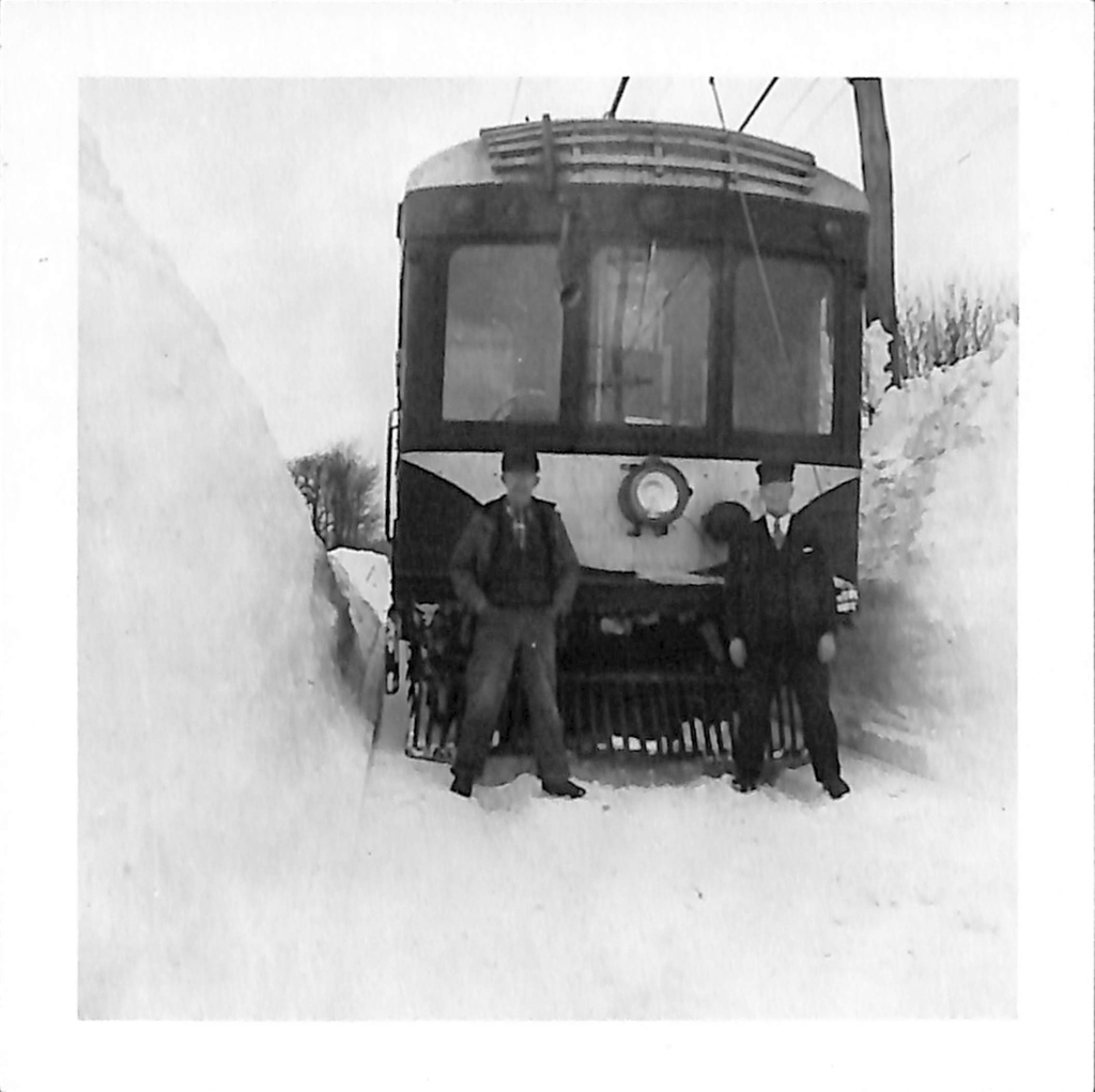 Motorman Reginald Phelps and conductor Charles Vanderwork posed in front of JW &amp; NW RR Car 303 in a snow drift at Chedwell in this week's #TrainTuesday photo from 1946. Photo courtesy of the Fenton History Center collection.