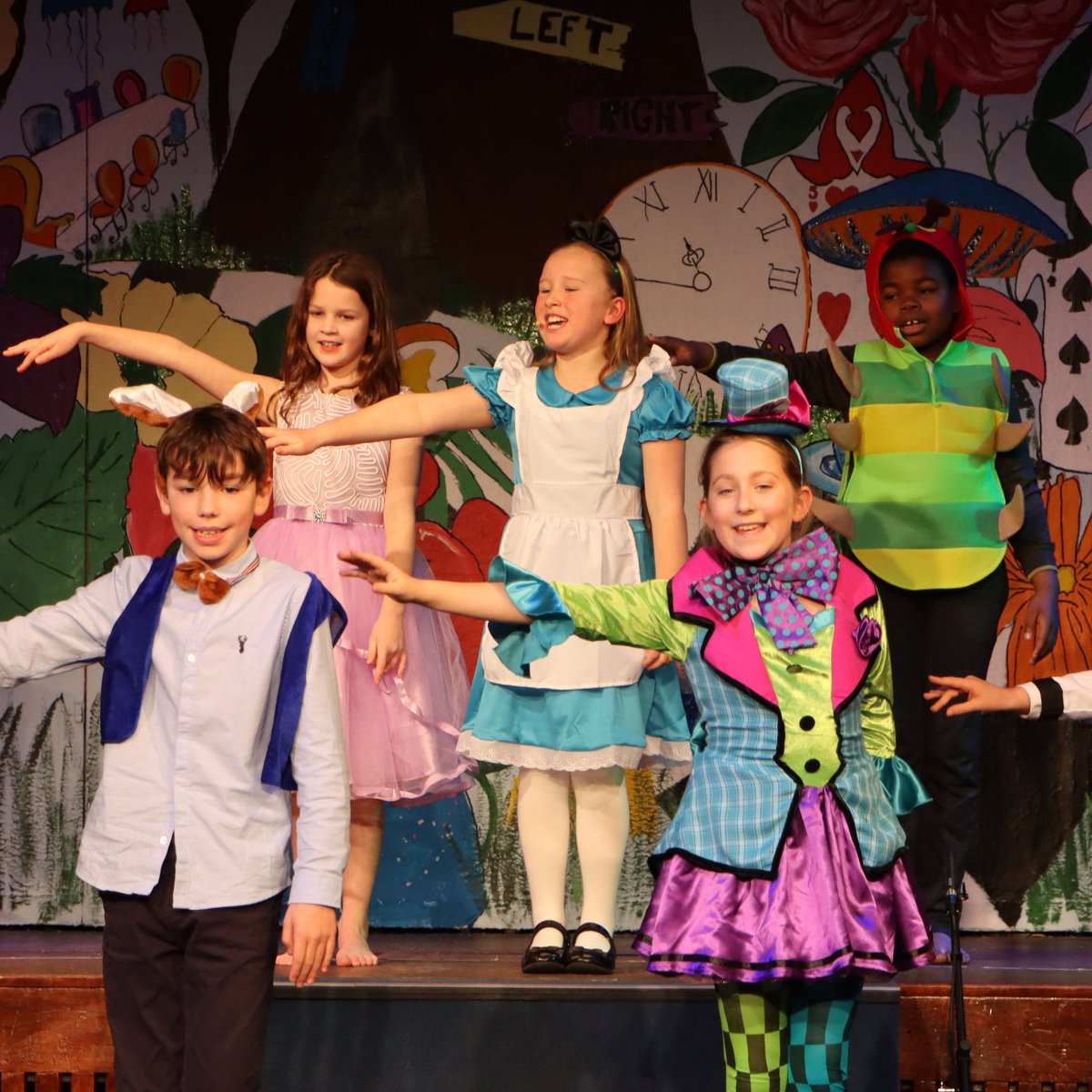 HawthornsSchool's tweet photo. What a wonderful performance of Alice in Wonderland, Year 4! It was clear that everyone thoroughly enjoyed acting, singing and dancing together. Well done all! #ASchoolForLife #LearningToPerform #AliceinWonderland https://t.co/sY4syq2TVe