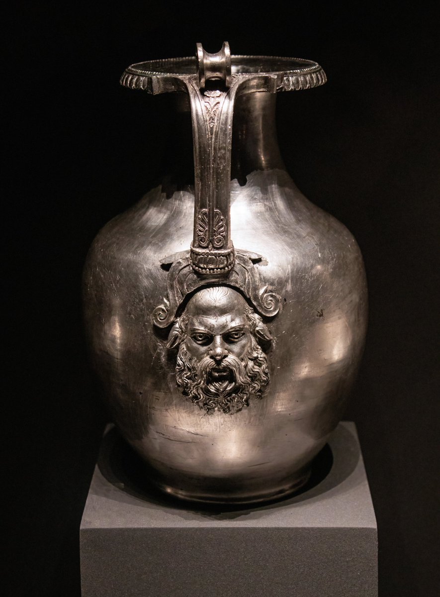 OptimoPrincipi's tweet image. Silver wine jug (oinochoe) decorated with the bearded face of Silenus - just one vessel from a complete silver banqueting set deposited in the tomb of King Philip II of Macedon (382-336 BC), father of Alexander the Great. Museum of the Royal Tombs, Vergina.