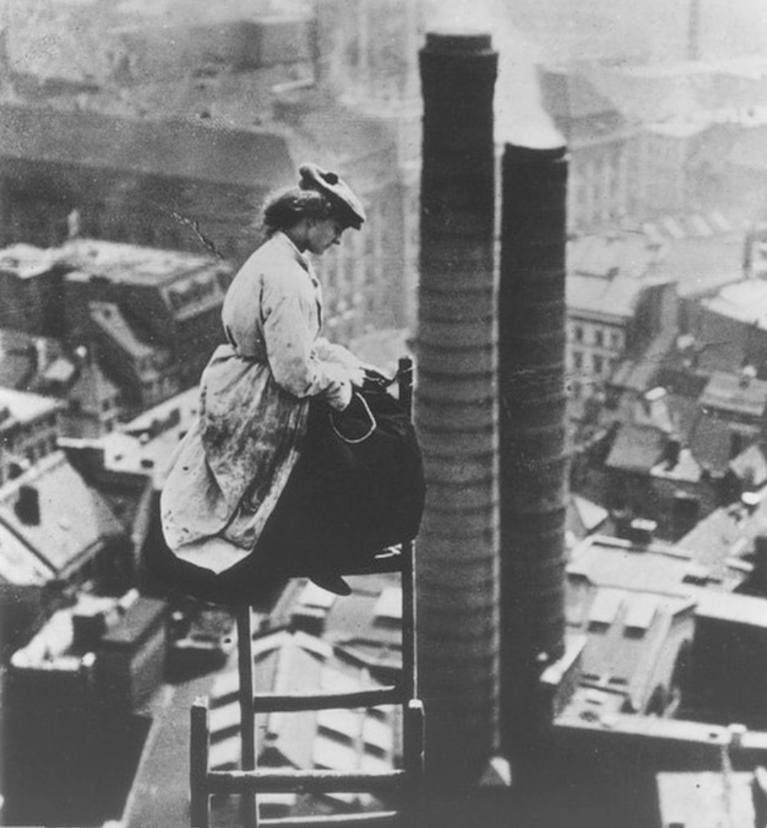 A female Mason,  high above Berlin in 1910. 
With the rise of industrialisation in Germany it was not uncommon for women to work, although usually this would be in factories. Photographed here is a master masons daughter doing renovation work on the old City Hall Tower in Berlin.