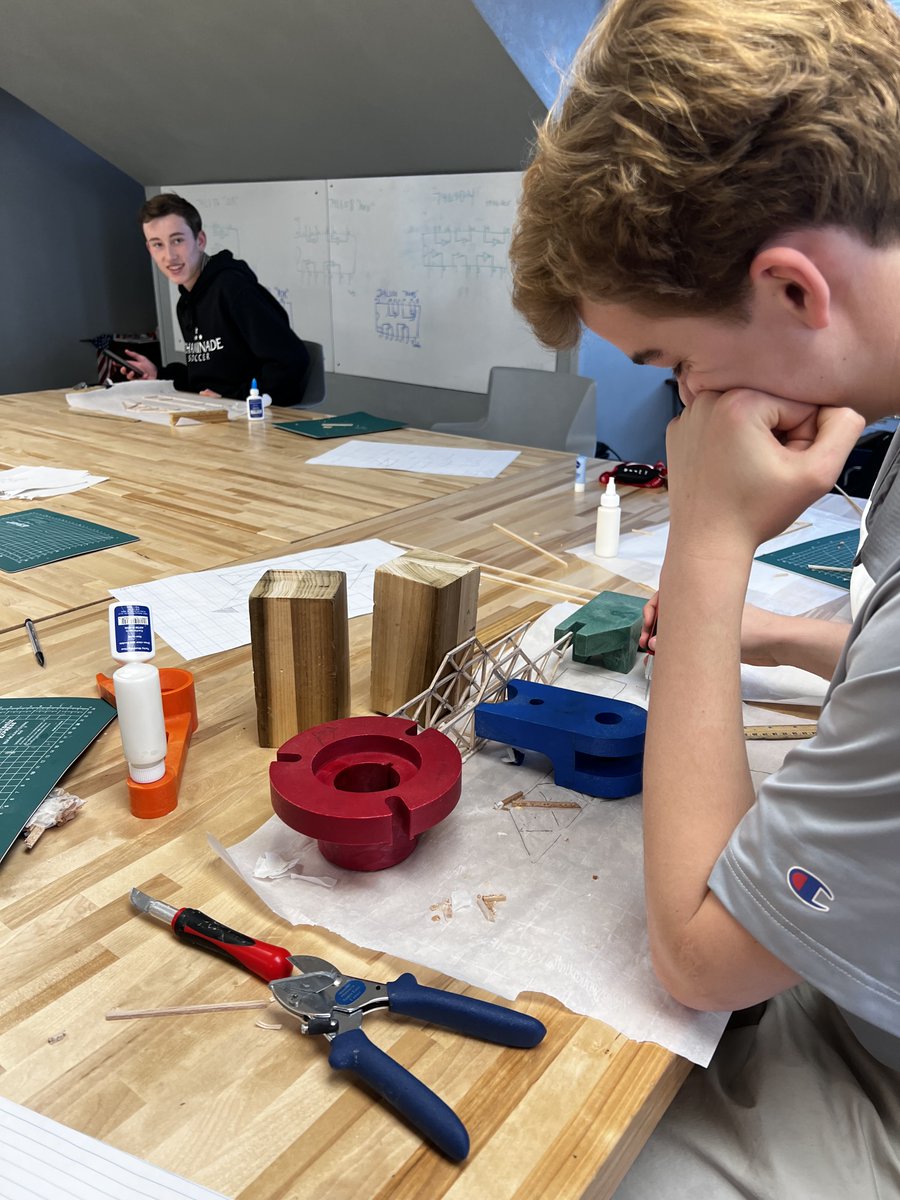 WeAreChaminade's tweet photo. Our engineering students are assembling their final semester project: a bridge model made of balsa wood. For most of the semester these students have been working on the design of their bridges, now it's time to build. Next week they will test out their designs. #CCPSTEM #EstoVir https://t.co/QD358vIXd0