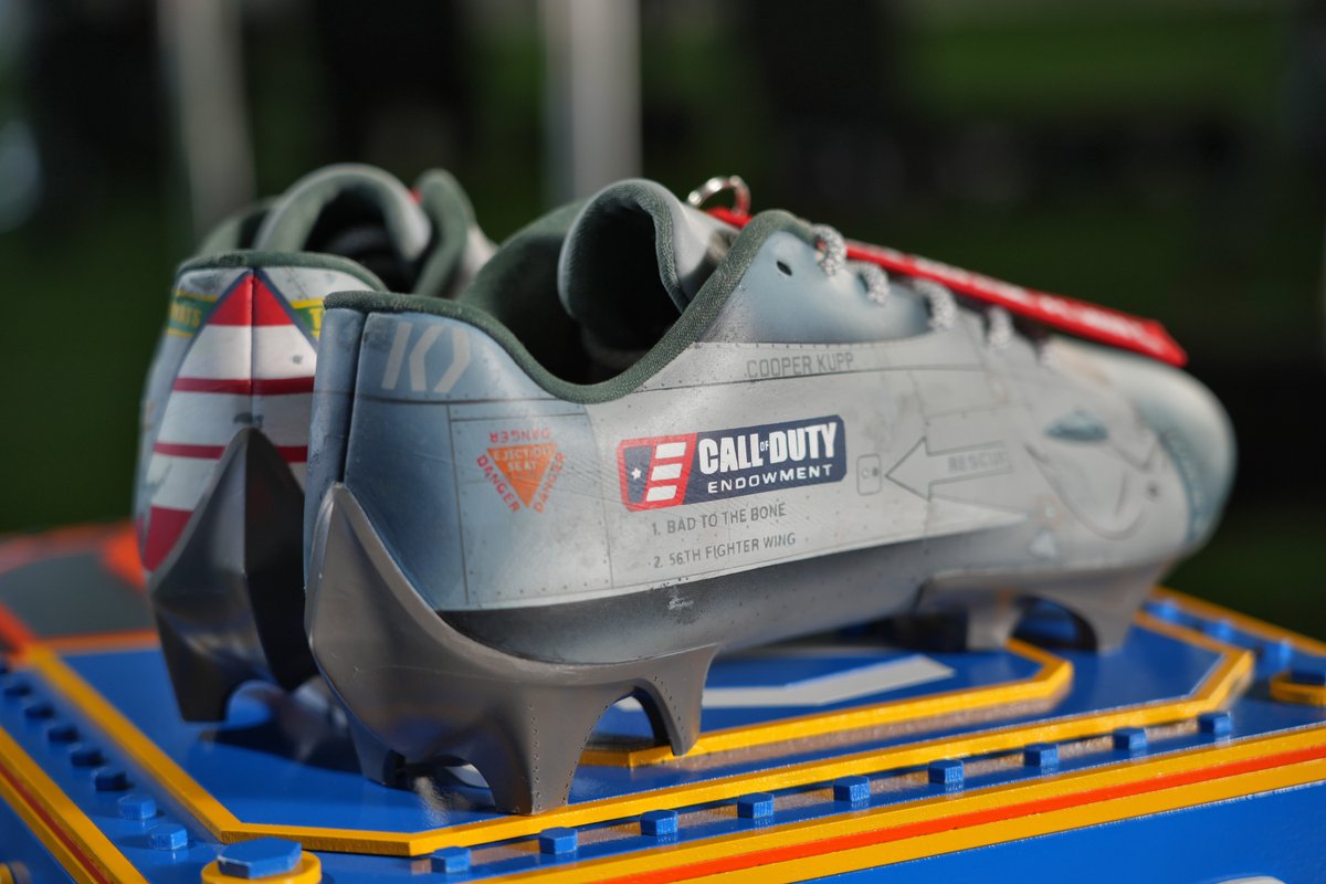 CODE4Vets's tweet photo. Because we just can't get enough, here are a few more glamour shots of @CooperKupp's cleats designed by @cestlavic for #MCMC. They take inspiration from @RamsNFL youth coordinator, Coach @mostreety--a U.S. Airforce #Veteran. https://t.co/AxIYxXPPjT