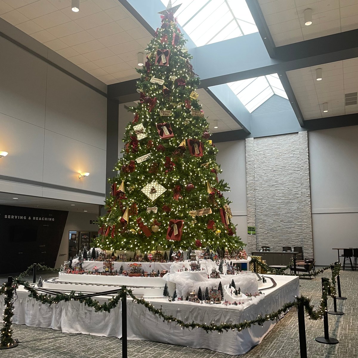ccclife's tweet photo. Come check out the train display surrounding our #GiantChristmasTree in the Atrium of the St. Charles/South Elgin Campus! There are even a few surprises hidden throughout the train display... have you found them all yet? 👀🚂 https://t.co/PLQiDm0OGC